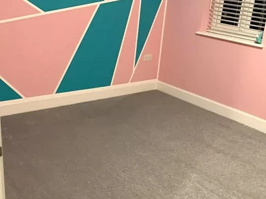 bedroom-carpet-grey-teal-feature-wall-newcastle-foxglove-flooring Grey carpet against a teal and pink geometric feature wall, Newcastle