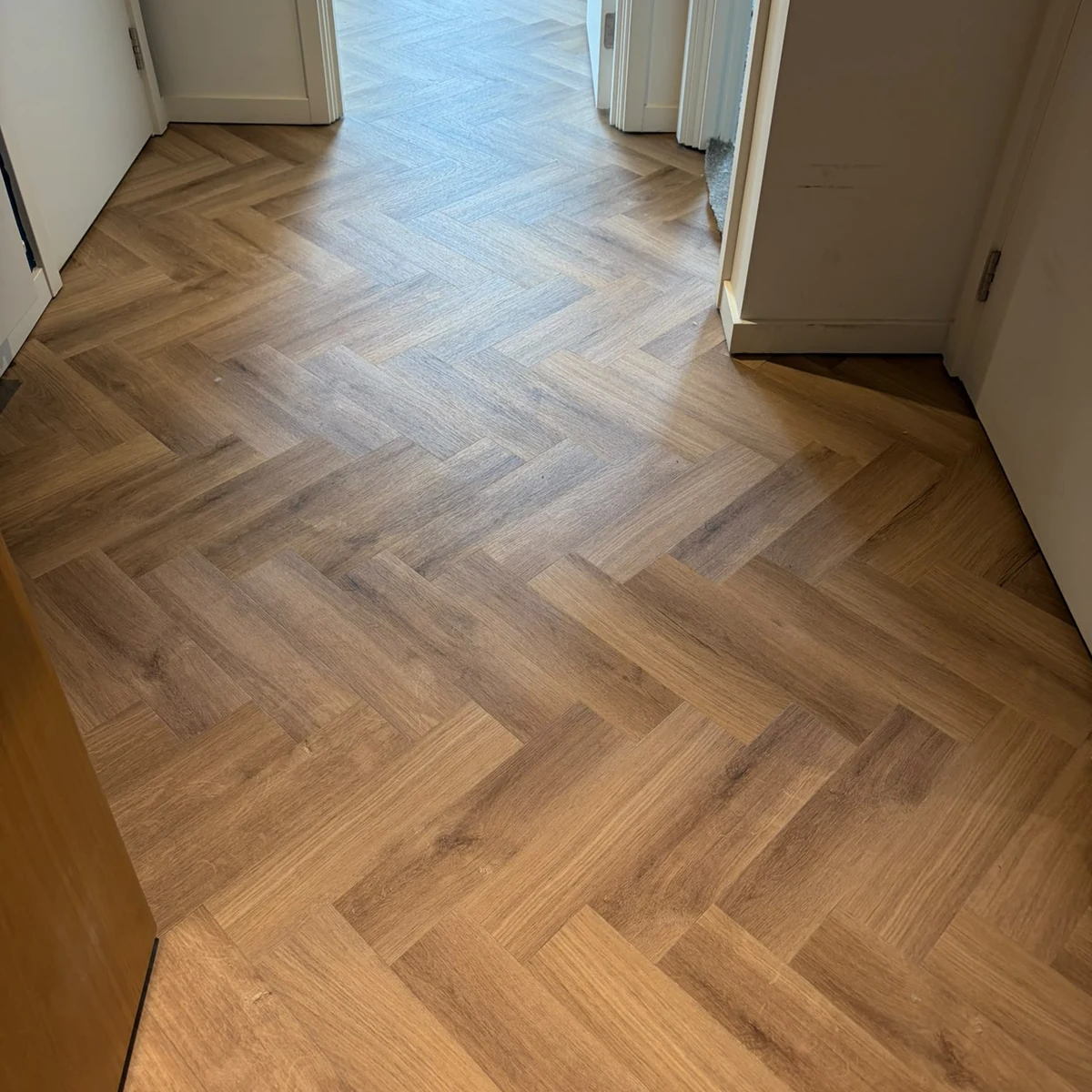 herringbone-vinyl-hallway-newcastle-foxglove-flooring The pattern running clean through the hallway, Newcastle