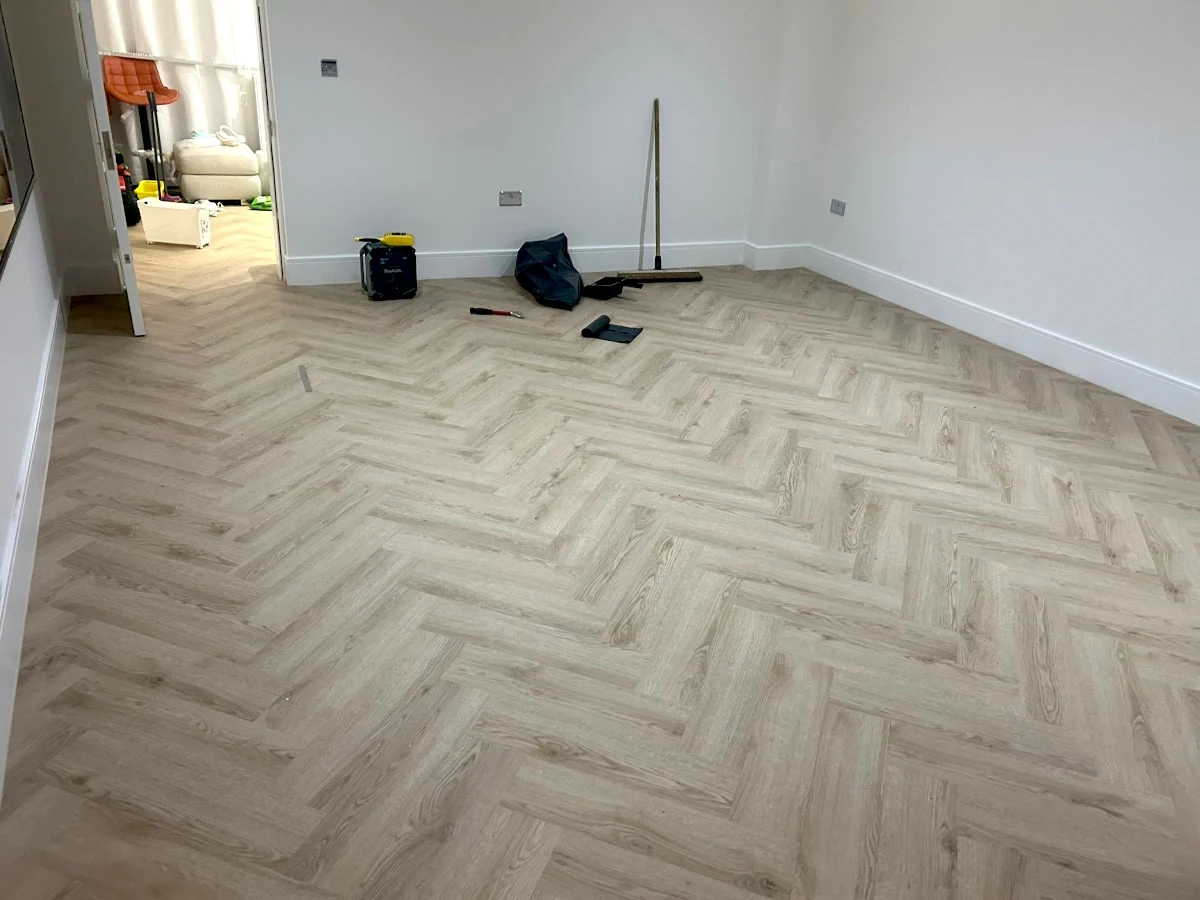 laminate-flooring-herringbone-room-view-newcastle-foxglove-flooring Herringbone laminate across an open-plan room