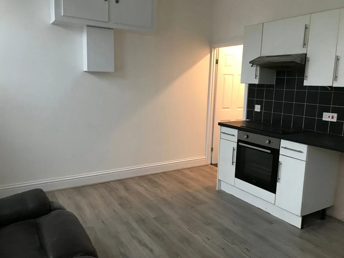 Wood-look floor between a kitchen and adjoining doorway