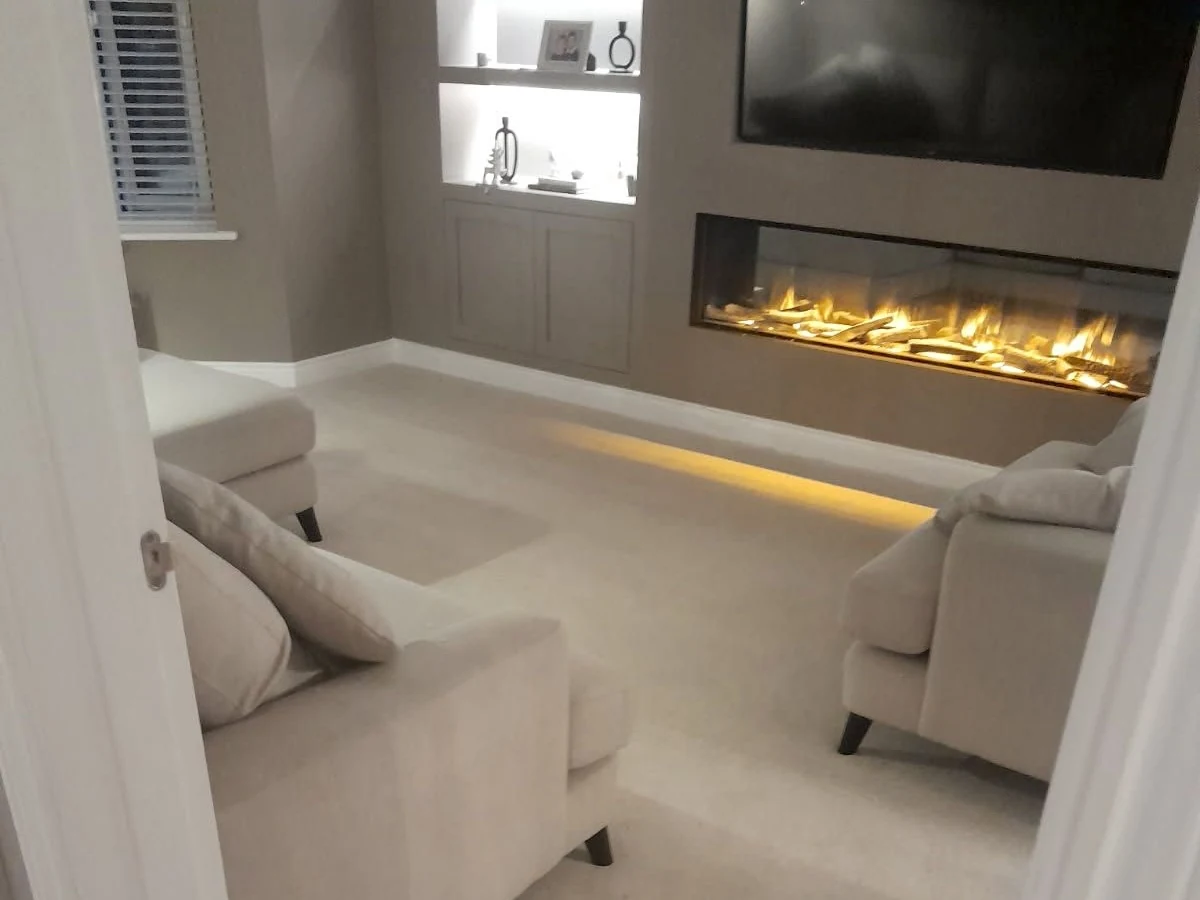 Cream cut pile carpet fitted in Newcastle living room with fireplace by Foxglove Flooring